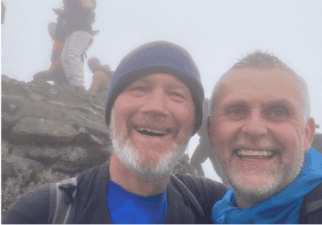 2 people smiling after a MND fundraiser walk