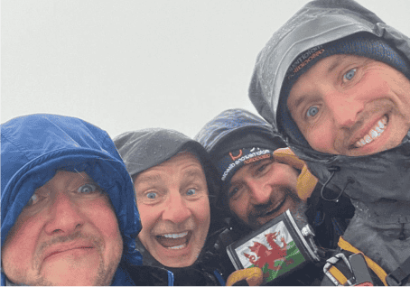 4 people smiling as they embarked on a MND fundraiser hike